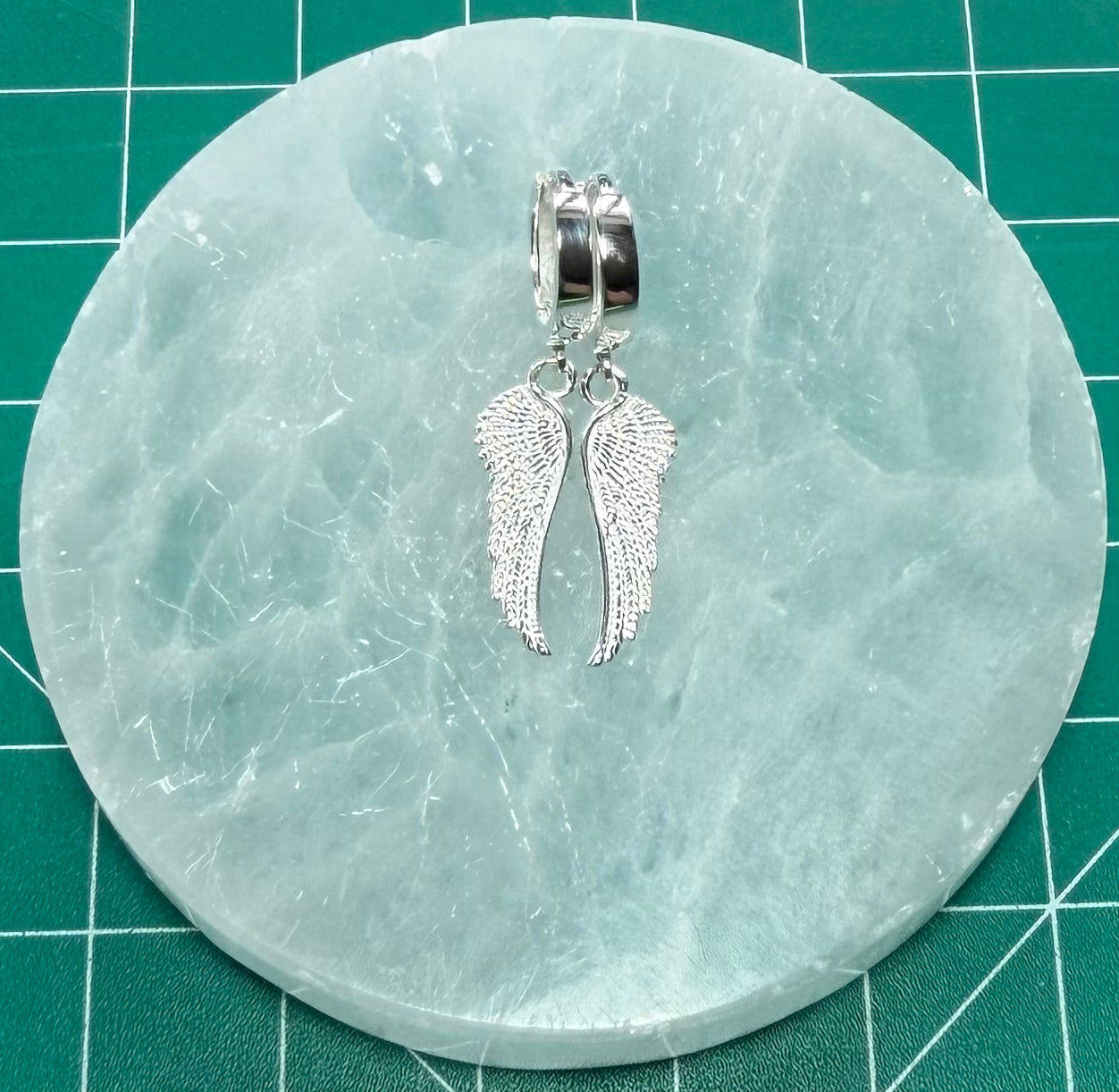 STERLING SILVER DOUBLE SIDED ANGEL WING HUGGIE EARRINGS