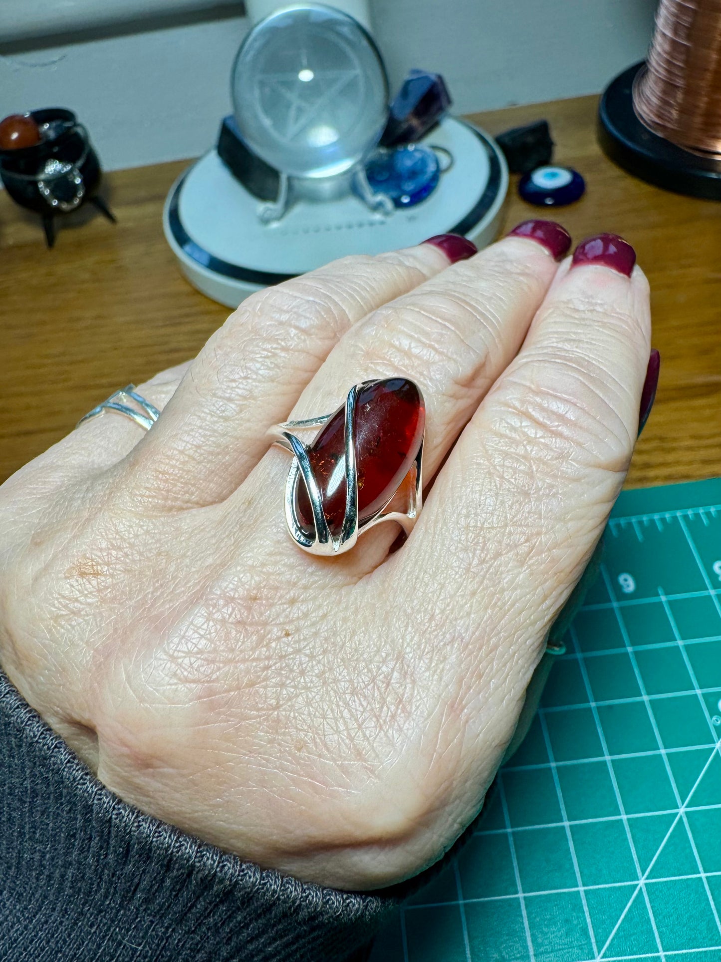 CHERRY AMBER AND STERLING SILVER ADJUSTABLE RING