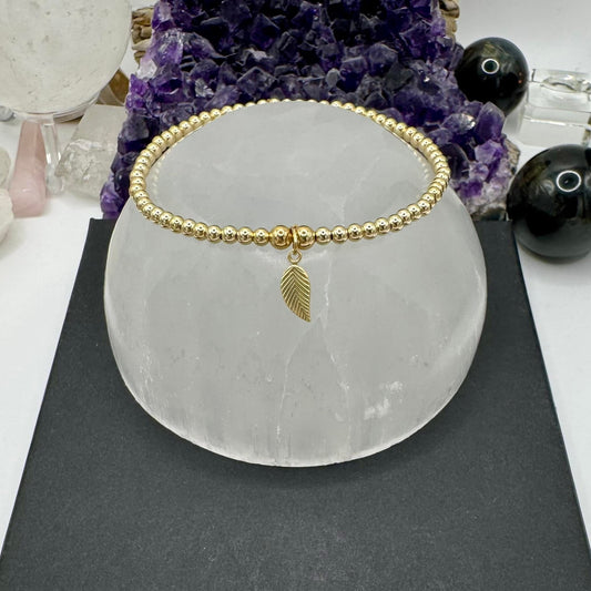 YELLOW GOLD BRACELET WITH LEAF CHARM